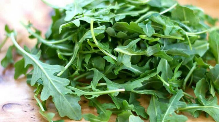the arugula leaves are placed on the table
