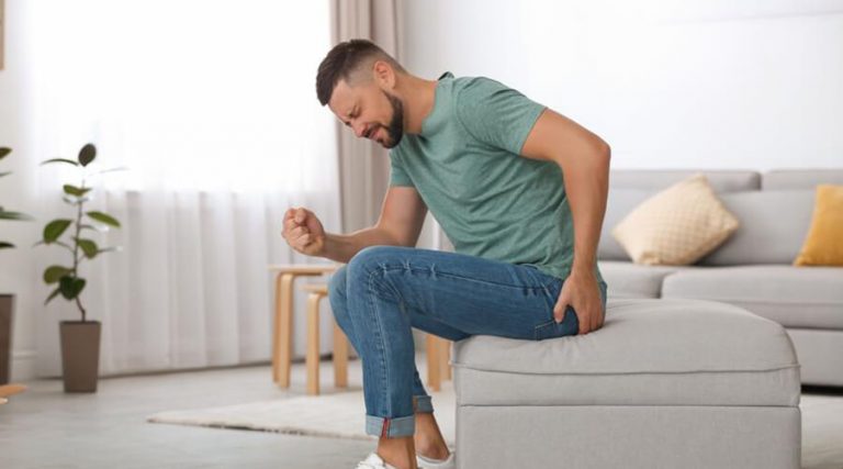 man experiencing pain