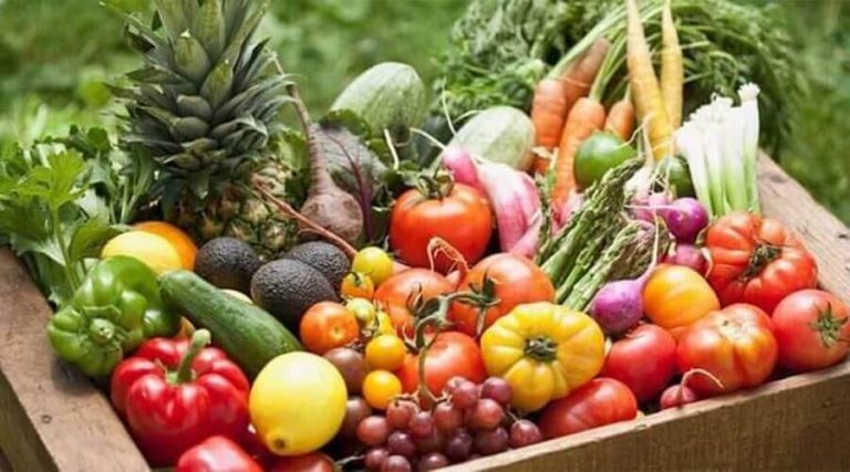 A basket contains fruits and vegetables that are alkalizing foods.