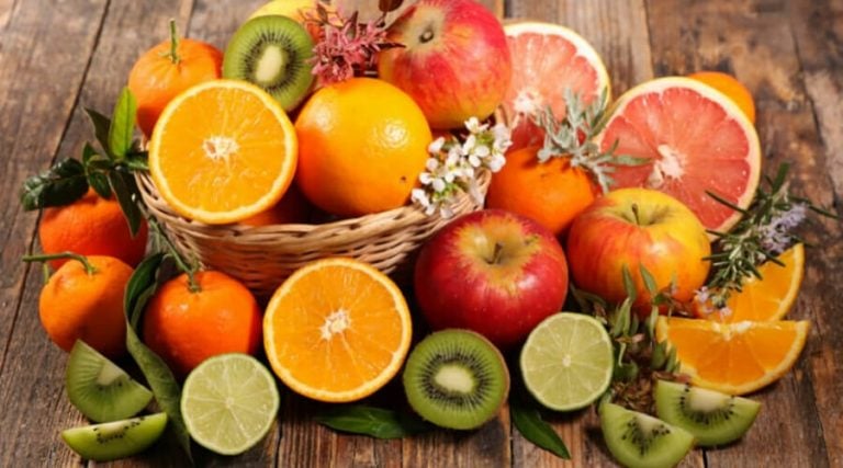Fruits which are rich in vitamins are kept on wooden table