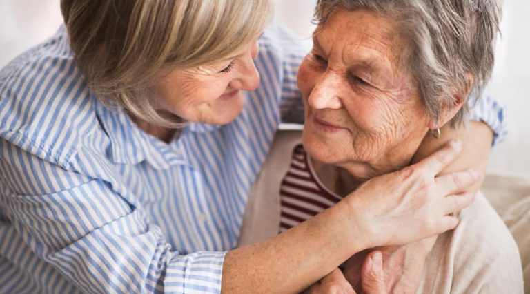 a picture of two old women hugging